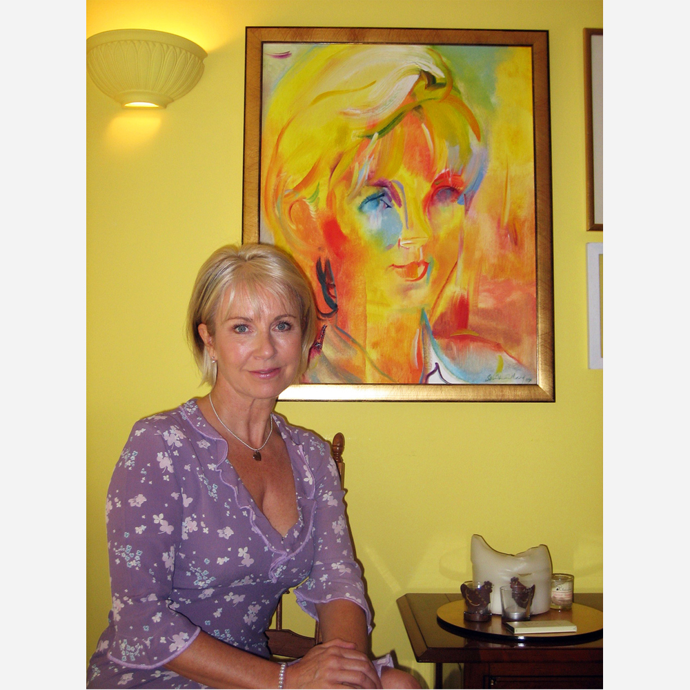 TV presenter Sarah Greene in 2006 with her 1996 portrait by Stephen B. Whatley portrait. 2006